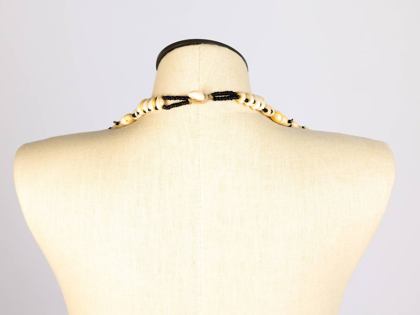 Cowrie layered necklace, back view