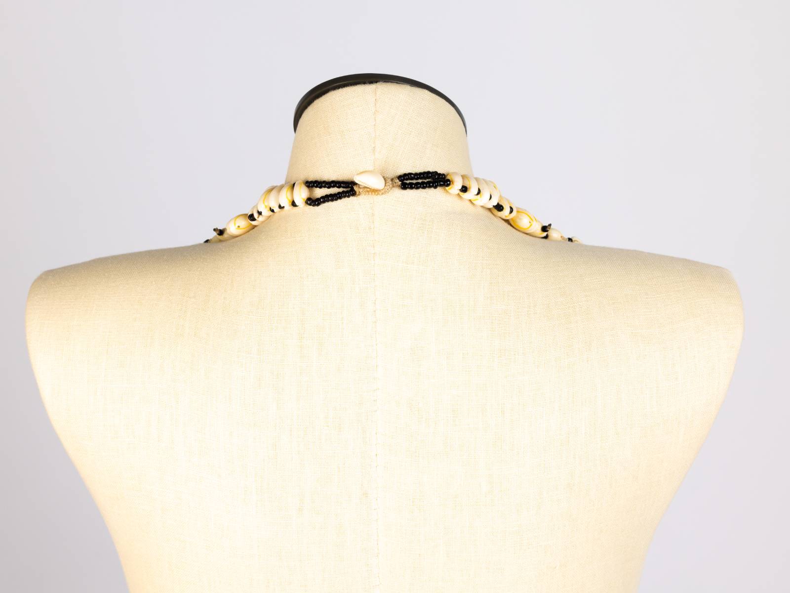 Cowrie layered necklace, back view