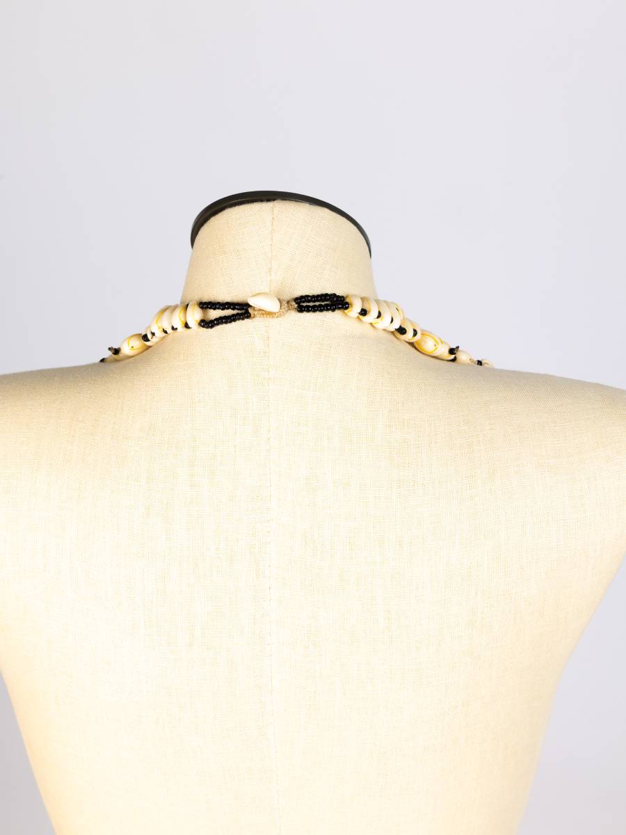Cowrie layered necklace, back view
