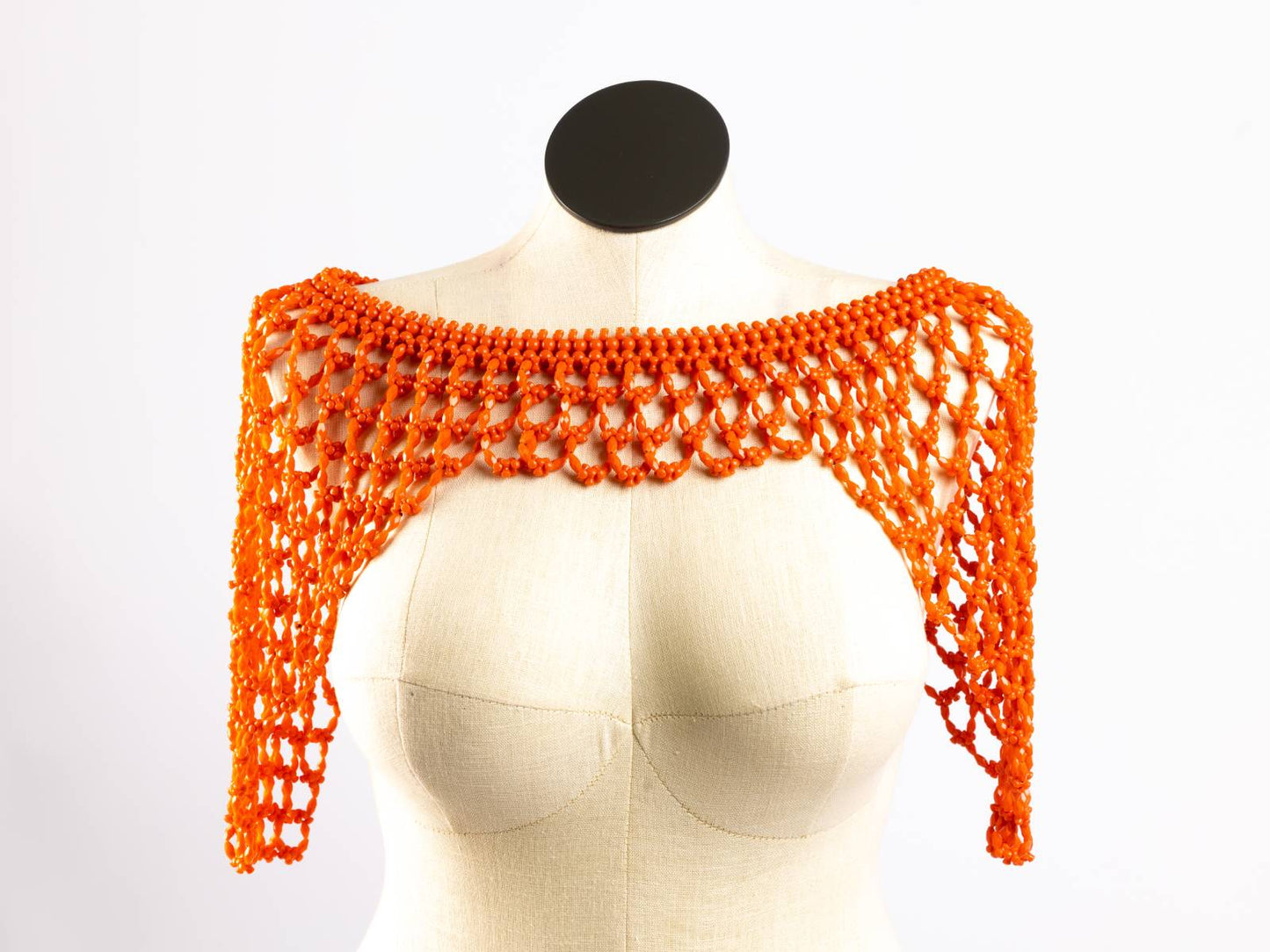 Orange cowry shell bridal bib, front view