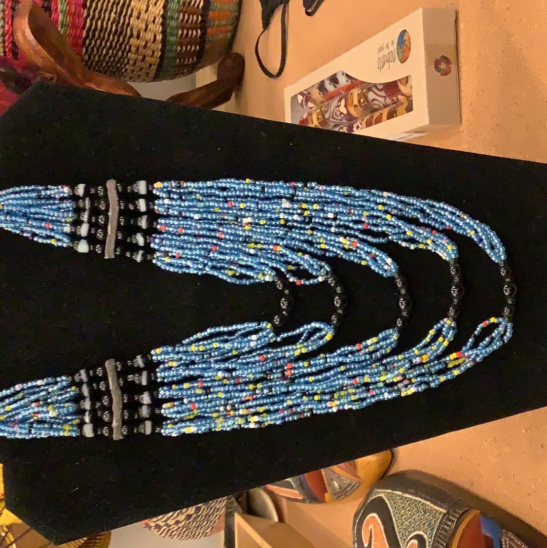 mostly blue beaded evelyn necklace, interspersed with red, white and yellow beads